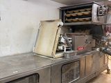 an image of a commercial kitchen with a lot of counter space