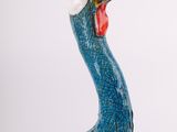 a blue bird with a long beak and a red beak