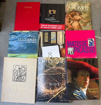 several books are sitting on the floor next to each other
