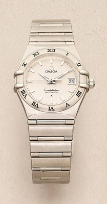 a close up of a watch with roman numerals on it