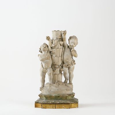 sculpture of a group of cherensils on a wooden base