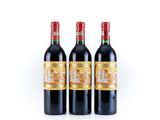 three bottles of red wine sitting next to each other on a white surface