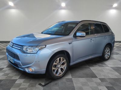 a picture of a blue suv parked in a garage