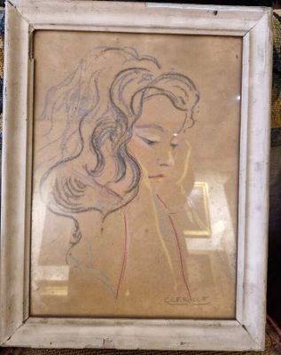 dessin représentant une femme aux cheveux longs, encadrée, allongée sur un canapé
