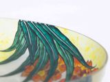 a close up of a bowl with a design on it