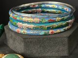 several different colored bangles are stacked on top of each other