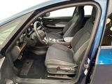 the interior of a car with the door open and the driver ' s seat down