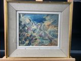 an oil painting of a landscape with clouds and water in a gold frame on a wooden easel