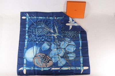 blue and white scarf with a picture of a tree and a box