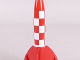 a toy rocket that is sitting on top of a table
