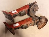 two old fire hydrants sitting on a table