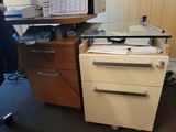 a desk with a file cabinet and a printer on it