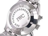 a close up of a watch on a white surface