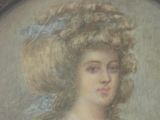 painting of a woman with a large hat in a frame