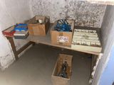 boxes of tools on a workbench in a room