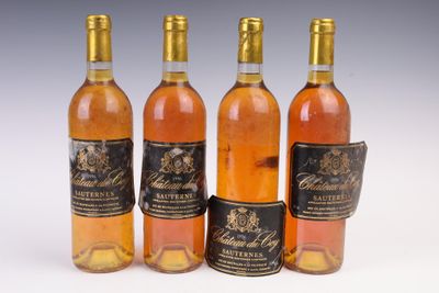 three bottles of wine sitting next to each other on a white surface