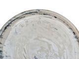 a close up of a plate with a bird on it