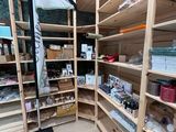 a wooden shelf filled with lots of items in a room