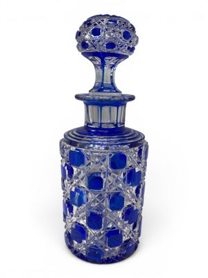 a close up of a blue glass bottle on a white background