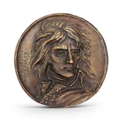 a close up of a coin with a man ' s face on it