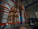 many pallets of wood stacked on the shelves in the warehouse