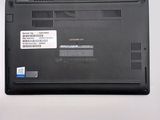 a black laptop that has a sticker on the back of it