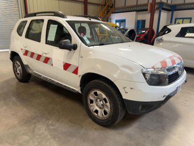 a picture of a white dacia parked in a garage
