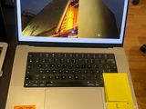 a laptop computer sitting on top of a wooden table