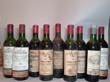 several bottles of wine are lined up on a table
