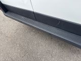 a close up of the side of a white van