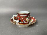 a cup and saucer on a saucer on a table