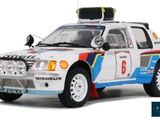 a model of a rally car on display on a white background