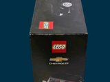 a black box with a lego car inside of it