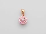 un pendentif en diamant rose sur fond blanc