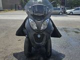 a motorcycle that is parked on the street in the parking lot