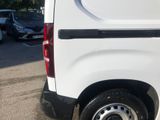 a white van that is parked in a parking lot