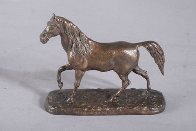 bronze statue of a horse on a base on a white background