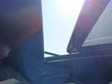 a view of the sun shining through the window of a car