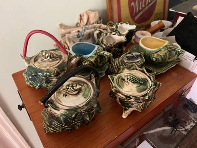 many different types of pottery on the table