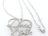 a close up of a necklace with a heart on it