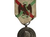 une image représentant une médaille sur laquelle figure le portrait d'un homme