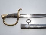 two different types of swords on a white surface