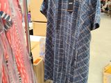 a dress hanging on a hanger in a store