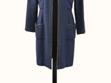 blue jacket on a mannequin stand on a white background