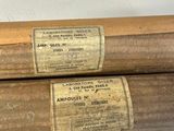 two baseball bats sitting next to each other on a table