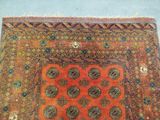 an orange and blue rug with a design on it