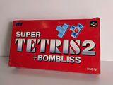 an image of a box of super tetris 2 and bombs on a table