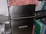 an image of a kitchen area with a sink and a refrigerator