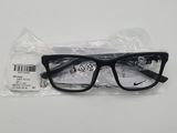 a close up of a pair of black glasses on a white surface