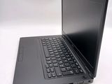 a black laptop with a black keyboard on a white surface